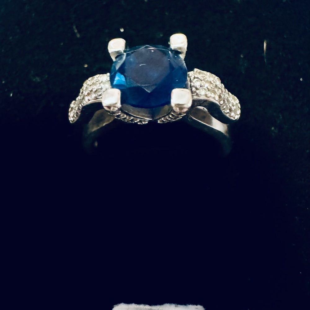 New blue sapphire ring with white sapphire, basil side stones in Sterling silver